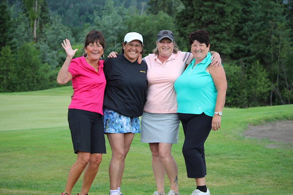 From left, Ladies Northern Open winners Hellen Slaney, Loraine Halfe, Dallas Edwards and Lillian Kelly celebrate their Ladies Northern Open victory on the 18th hole at the Smithers Golf and Country Club July 18. (Thom Barker photo)