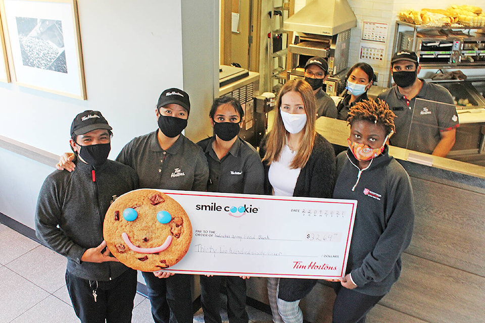 26594008_web1_210930-SIN-tim-hortons-salvation-army-smile-cookie-donation_1