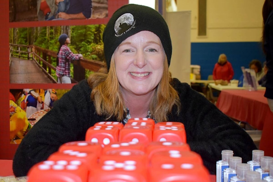 Striving for balance, Debbie Scallion of the BC Responsible & Problem Gambling Program promotes awareness at the 62nd ANBT vendor booth, on April 7. (Photo: K-J Millar/The Northern View)
