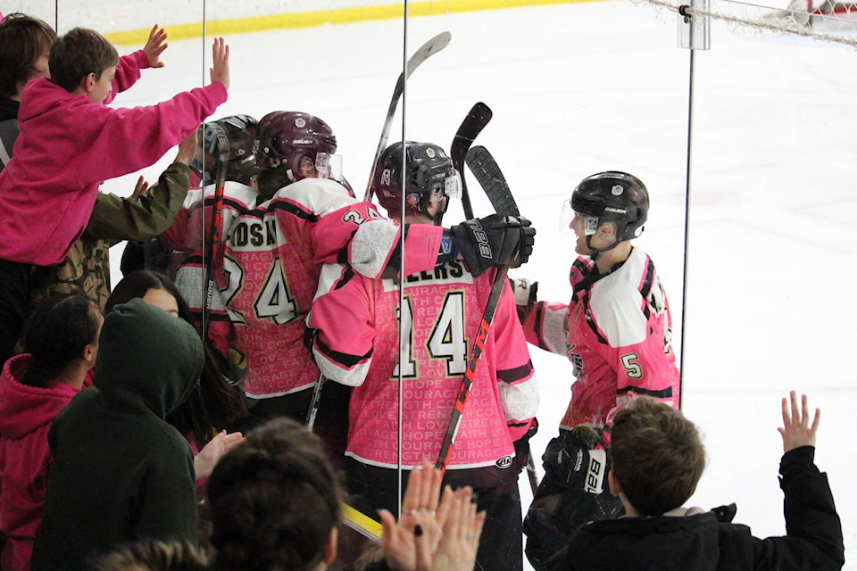 Rupert Rampage fans and players celebrate the first goal of the night against the Terrace River Kings Jan. 28 at the Jim Ciccone Civic Centre. (Thom Barker photo)