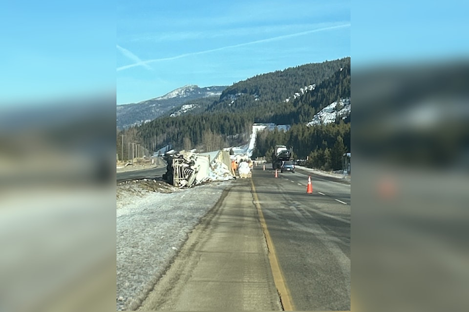 A semi truck lays on its side in the median on the Coquihalla Highway following a crash on Tuesday, Dec. 2, 2024.