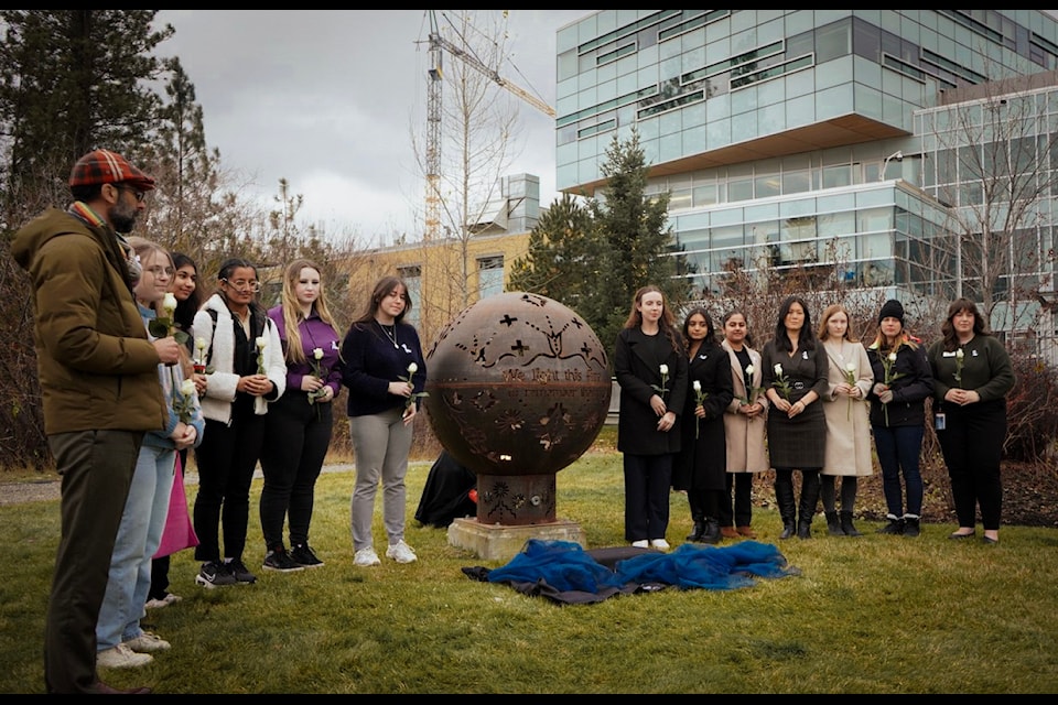 On Dec. 6, 2024, UBC Okanagan students, staff and supporters placed white roses at the base of the Memorial Fire Bowl, located outside of the campus' engineering building,