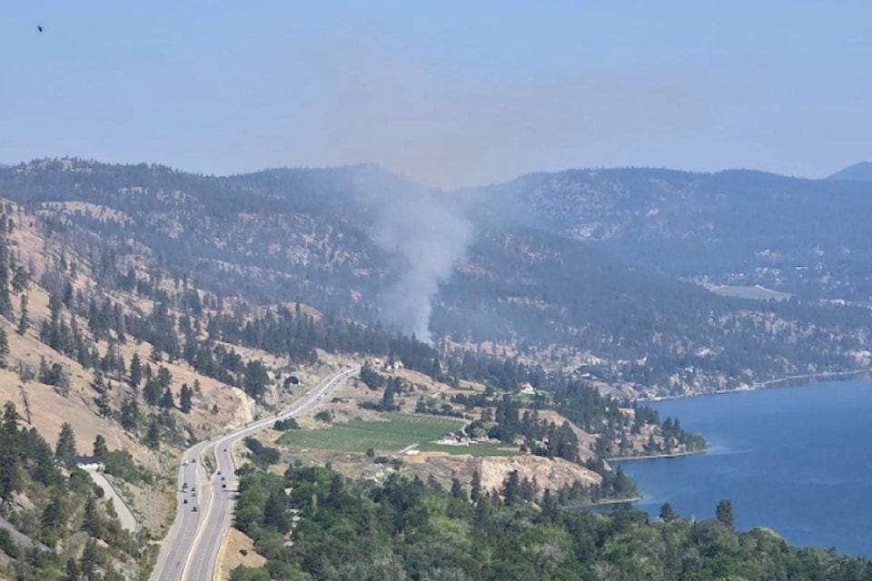 Emergency crews are dealing with a grass fire along Highway 97 in Peachland.
