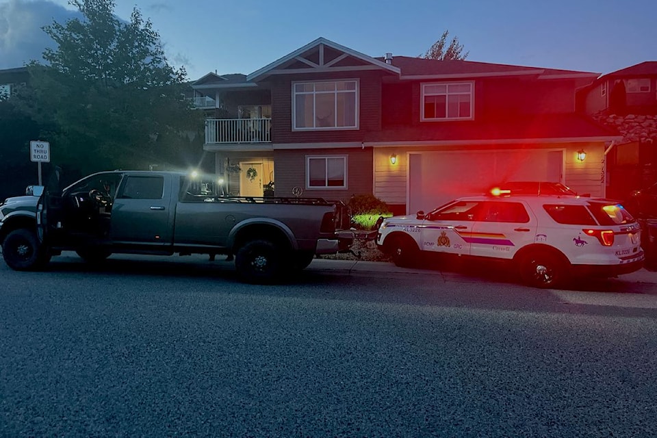 RCMP search vehicle in front of a home in Black Mountain.