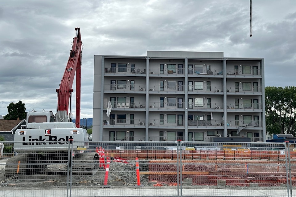 Items can be seen left behind on the balconies of Hadgraft Wilson Place after residents were evacuated on April 2 due to structural damage caused by neighbouring construction of the UBCO downtown Kelowna campus. Construction of the campus can be seen in the foreground. 