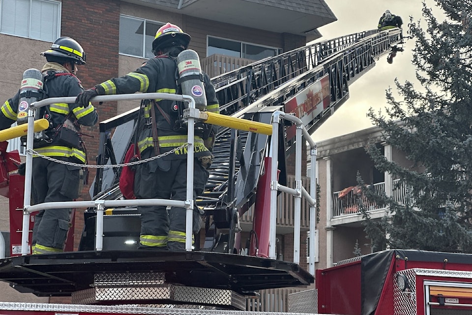 Fire crews attack blaze in third-floor corner unit.