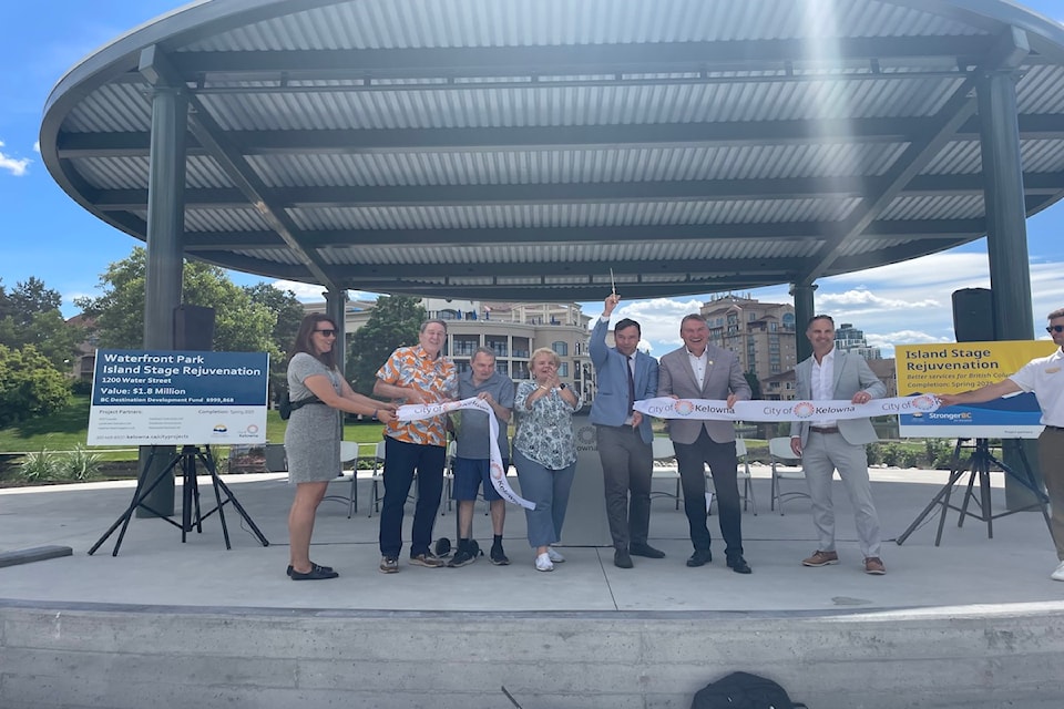 BC’s Minister of Tourism, Arts, Culture and Sport, Spencer Chandra Herbert (centre) cuts the ribbon  to celebrate the renovated Island Stage in Waterfront Park along with members of city council and staff.