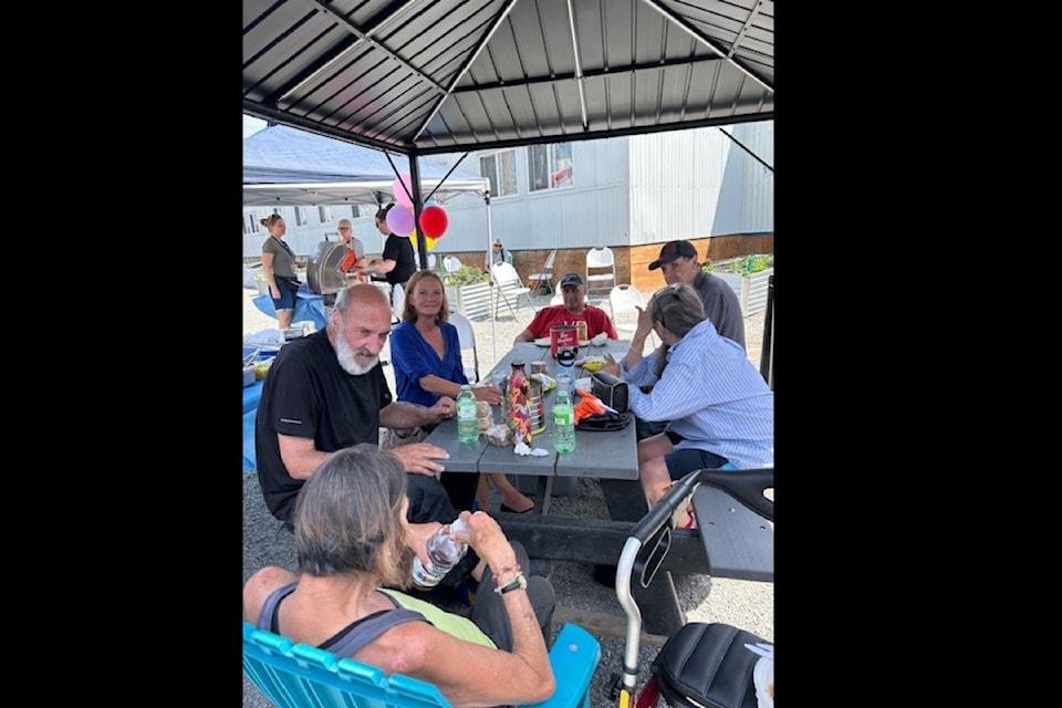 Trailside Transitional Housing celebrated its one-year anniversary on Wednesday, June 11 with a community clean up and BBQ.