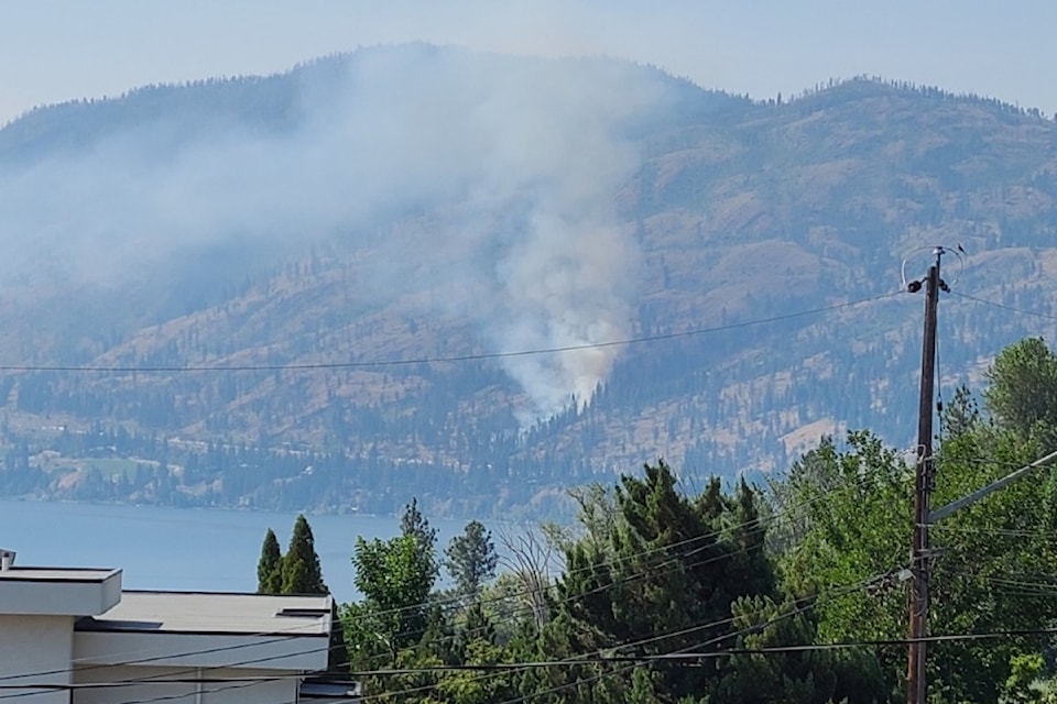 Emergency crews are dealing with a brush fire along Highway 97 in Peachland.