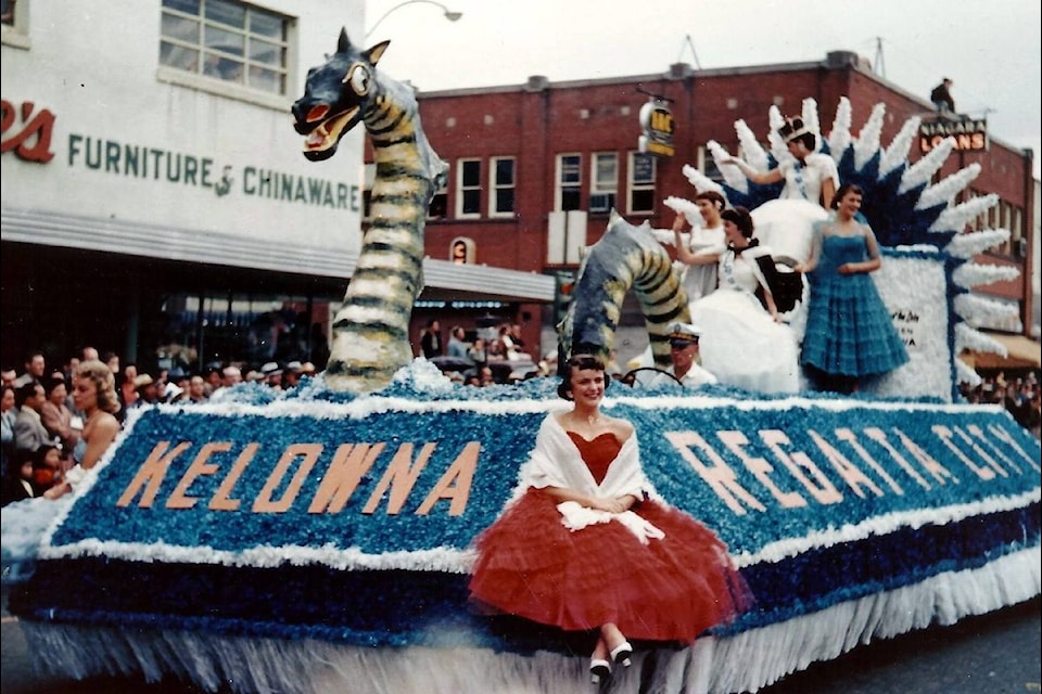 This historic photo is of the Lady of the Lake float during the Kelowna Regatta Parade in 1957. 

Lorraine Braden (Warren) is sitting on the front corner of the float wearing the red dress.