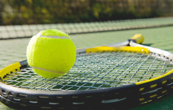 Tennis Racket and Ball on Court