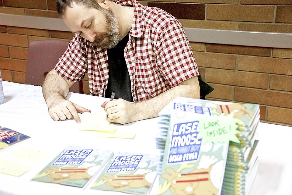 Douglas David Farrow Canadian cartoonist Doug Savage signs copies of Laser Moose and Rabbit boy during the 鶹ѡ Comic and Collectibles Expo, Sunday, at Parkinson Recreation Centre.