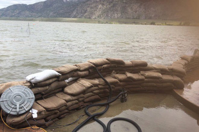 11942176_web1_180511-PWN-Osoyoos-flood-T