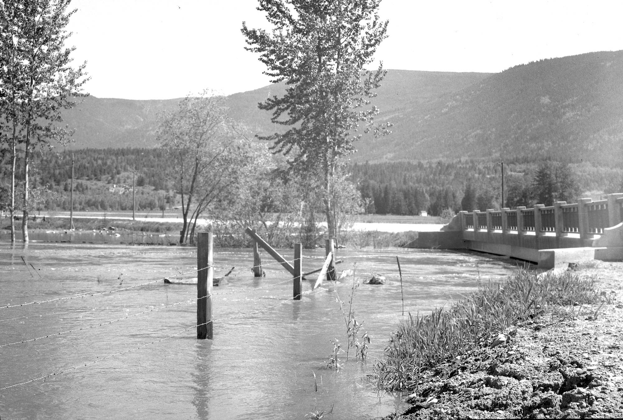 12086955_web1_180530-SAA-1948-flood-Salmon-River-bridge-1012