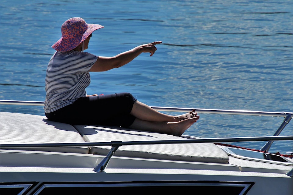 12543966_web1_180630-KCN-woman-on-boat_1