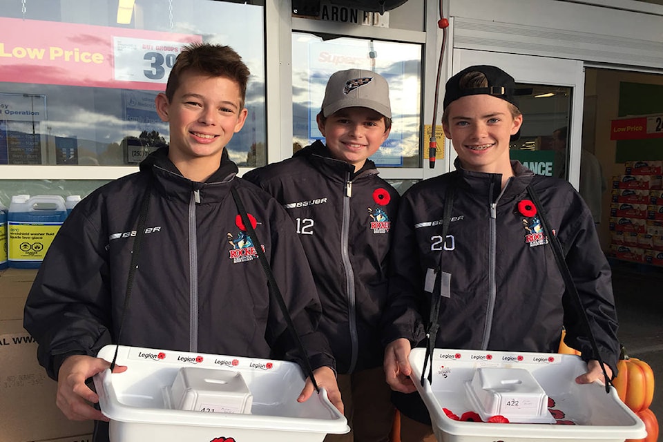 14207356_web1_181031_KCN_hockey-players-sell-poppies