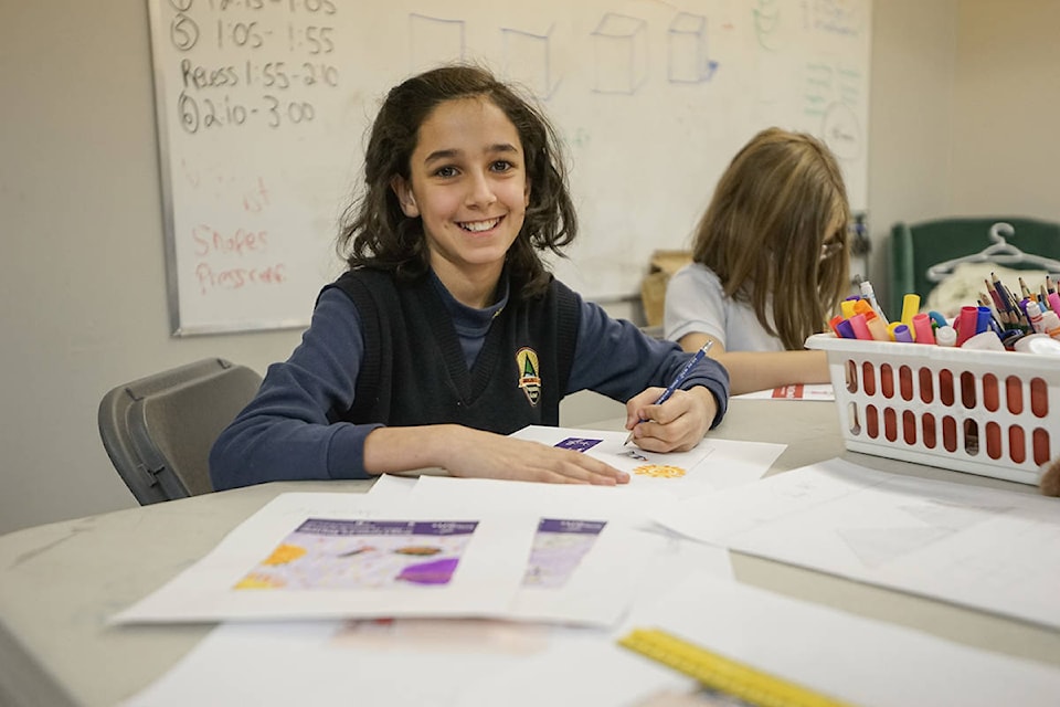 Grade 4 and 5 students at Aberdeen Hall Preparatory school are using the art design skills learned in class and applying them to creating ads for Kelowna companies. (Photo contributed)