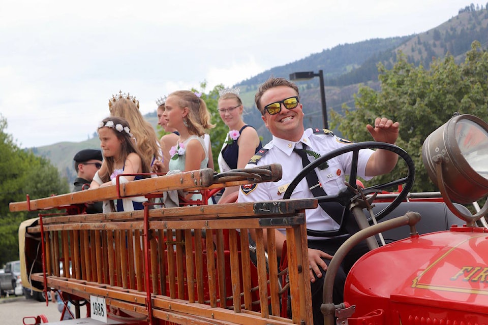 Josh Wade gives royalty and ambassadors fire truck ride. (Jennifer Blake photo)