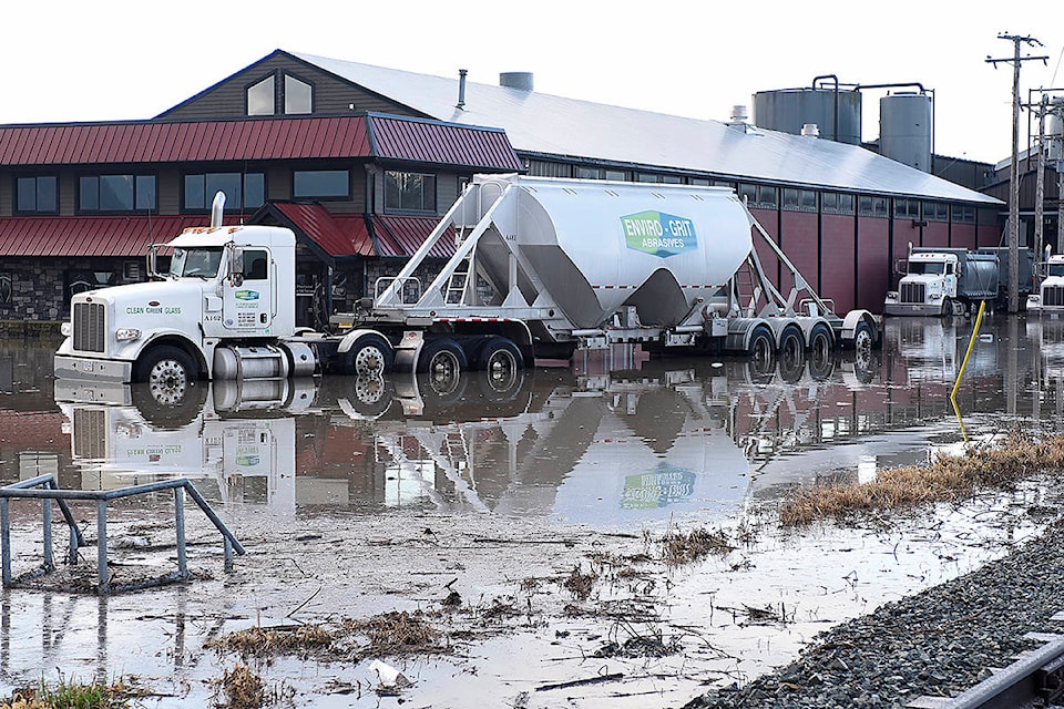 A truck sits in flood water at a business park on the Canadian side of the Sumas border crossing in Abbotsford on Sunday, Feb. 2, 2020. (John Morrow)