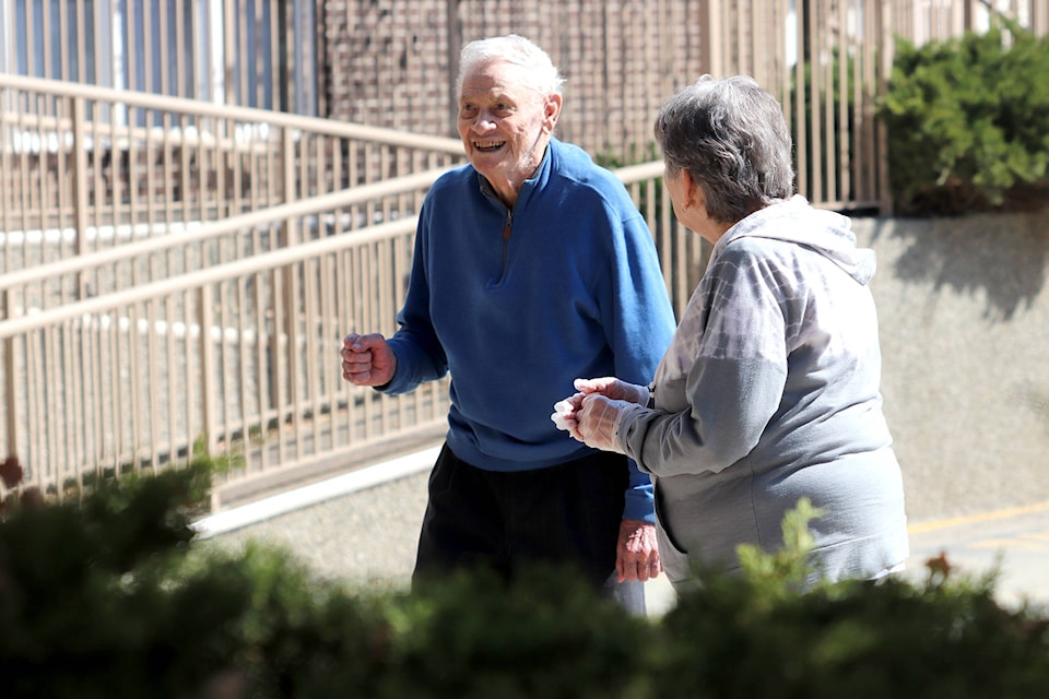 Residents of Columbus Court kicked up their heels in the parking lot as they were treated to an outdoor concert by Bob King Thursday, April 16. (Jennifer Smith - Morning Star)