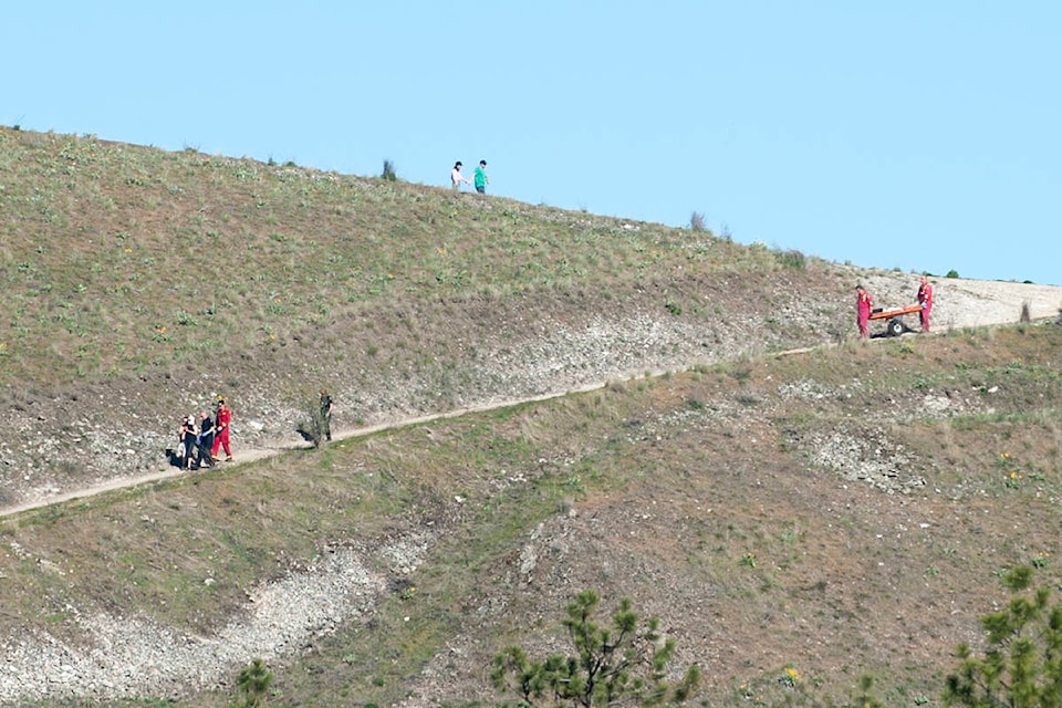 The family walked part of the way down the trail before being transported the rest of the way by a rescue vehicle. (Michael Rodriguez - Capital News)