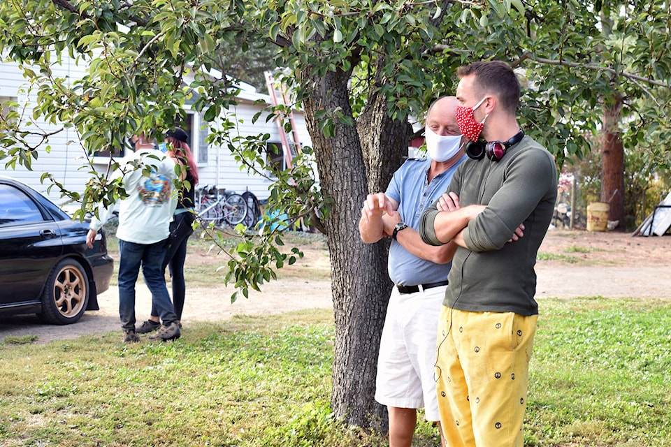 Bob McAtemney and Joey Munroe talk during the shooting of Walk With Me in Cawston on Oct. 7. (Brennan Phillips - Keremeos Review)