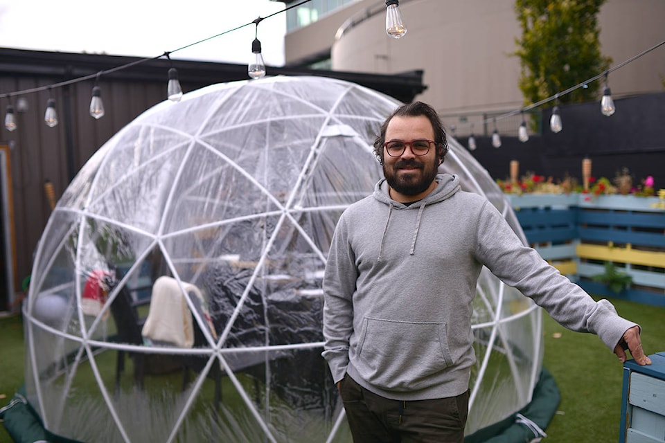 Curious Artistry and Alchemy Café owner, Luigi Coccaro, in front of their new bubble dining experience. (Phil McLachlan - Capital News)