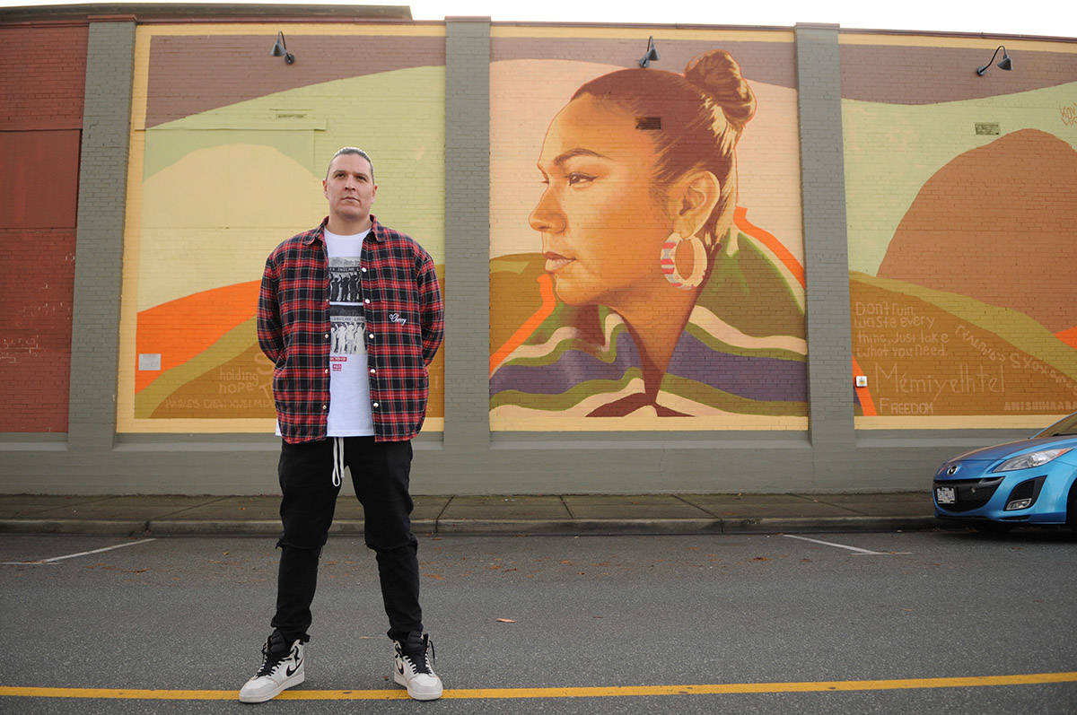 Justin Louis of Chilliwack, seen here on Nov. 21, 2020 beside a mural of his wife Inez Louis, is one of the designers who will be featured on Nov. 26 as part of Indigenous Fashion Week Toronto. (Jenna Hauck/ Chilliwack Progress)