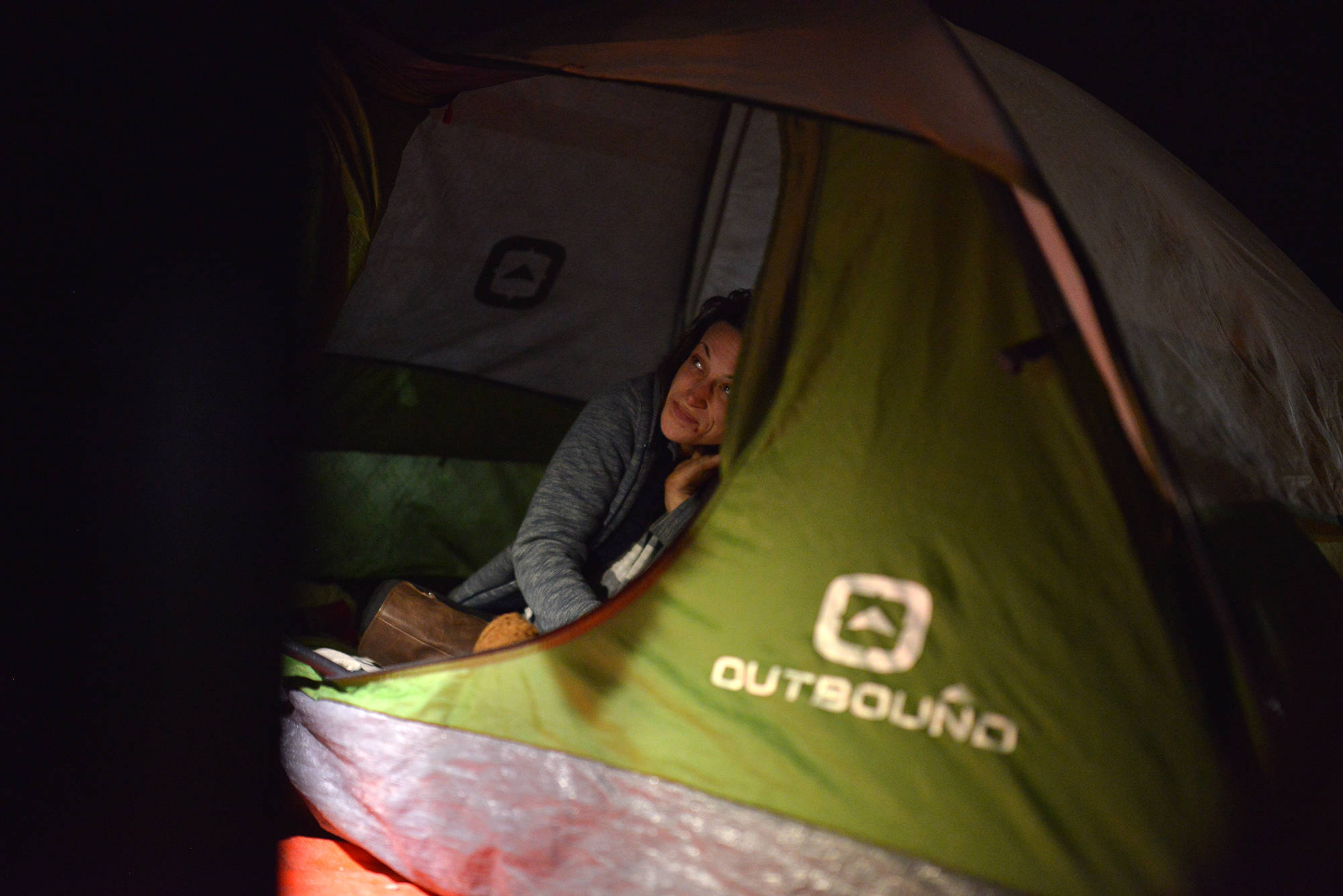 Stephanie Hermiston enjoys her turkey dinner inside her tent. (Phil McLachlan - Capital News)