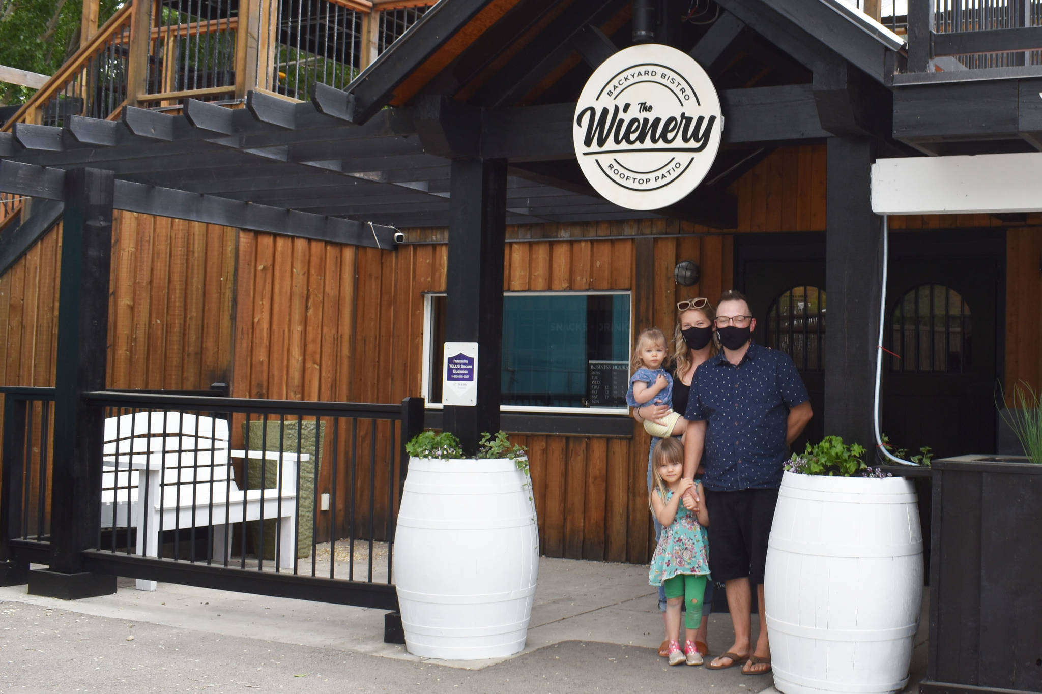 The Wienery owners Tahanee Adams and Campbell Kearns with two of their three girls, are parking the food truck to open up a restaurant with three patios at the Barefoot Resort in Skaha. (Monique Tamminga Western News)