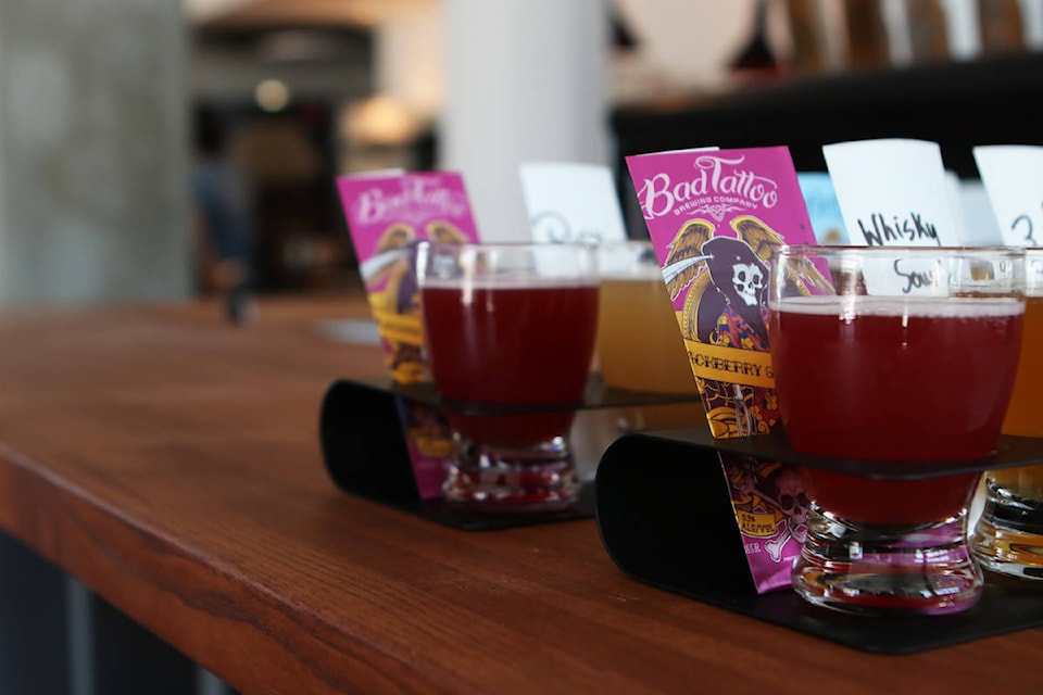 Flights of Bad Tattoo beers are prepared at the Kelowna location. (Aaron Hemens/Capital News)