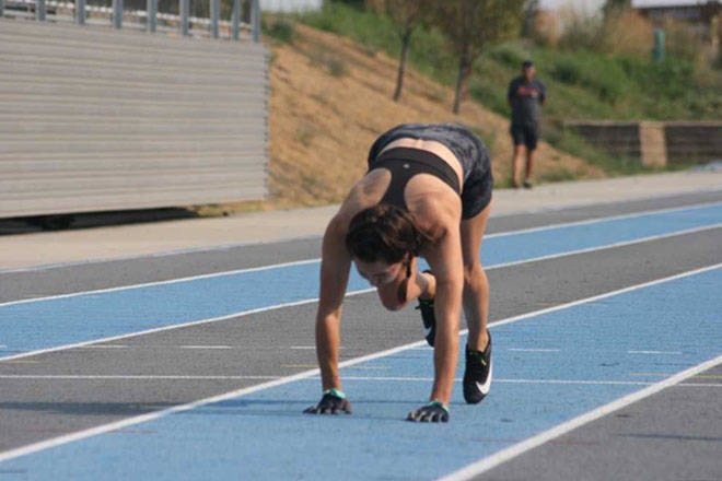 Vernon summer resident Julie McCann (née Holland) set an unofficial world record Monday, Aug. 9, at Greater Vernon Athletic Park, becoming the fastest woman to run 100 metres on all fours with a clocking of 22.99 seconds. (Christine Castrucow photo)