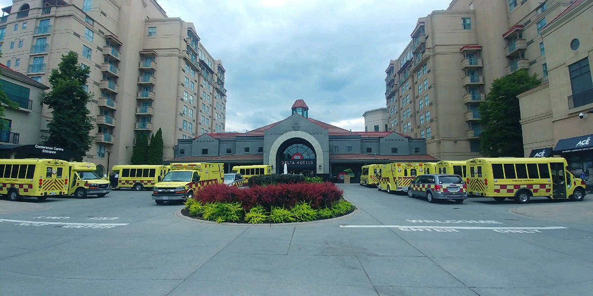 The parking lot was filled with transport vehicles that were kept busy for days moving patients around the province, and away from forest fires. (Submitted)