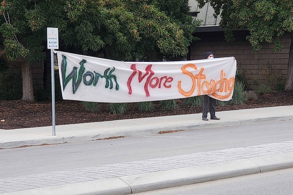 A crowd of approximately 30 protesters took part in the provincewide solidarity action: RCMP Stand Down on Monday, Aug. 23, out front of the Vernon RCMP detachment. (Roger Knox - Vernon Morning Star)
