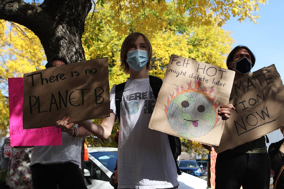 Nearly 50 people rallied outside of Kelowna City Hall before marching down Bernard Avenue and delivering a letter demanding climate action to Kelowna-Lake Country MP Tracy Gray’s office. (Aaron Hemens/Capital News)