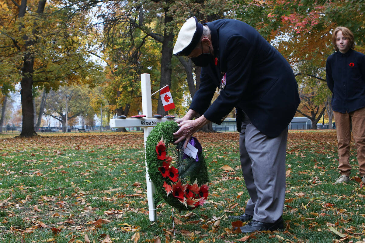 95-year-old Rev. Dick Fletcher, a WWII veteran with the Royal Canadian Navy, lays down a wreath at the cross of the Unknown Soldier during the Field of Crosses Remembrance Day tributes opening ceremony at Kelownas City Park on Nov. 2. (Aaron Hemens/Capital News)