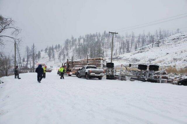 Snow causes issues for a logging truck on Westside Road on Dec. 6. (Mandi Poss/ Facebook)