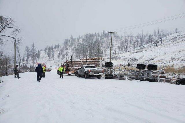 Snow causes issues for a logging truck on Westside Road on Dec. 6. (Mandi Poss/ Facebook)