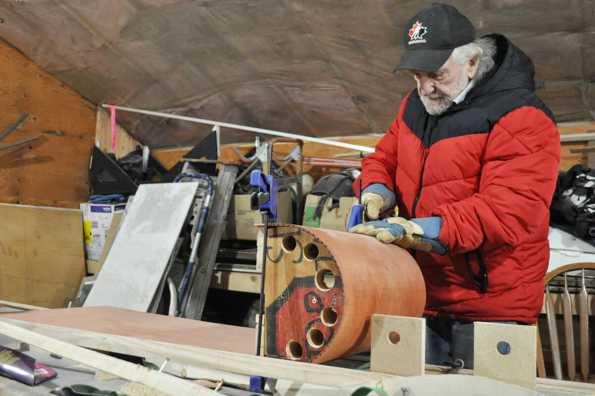 Al Magaw shows off a new sled he聮s been building in his spare time. His first sled, he says, was built using a broken bar chair. Photo: Tyler Harper