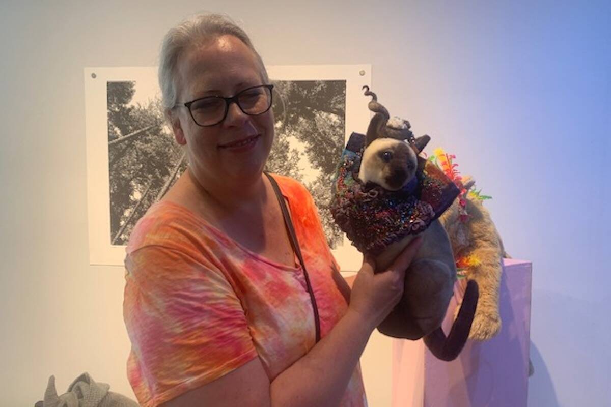 Shauna Reid holding her wearable art for cats submission at Lake Country Art Gallery聮s Catwalk June 26, 2022 (Brittany Webster - Black Press)