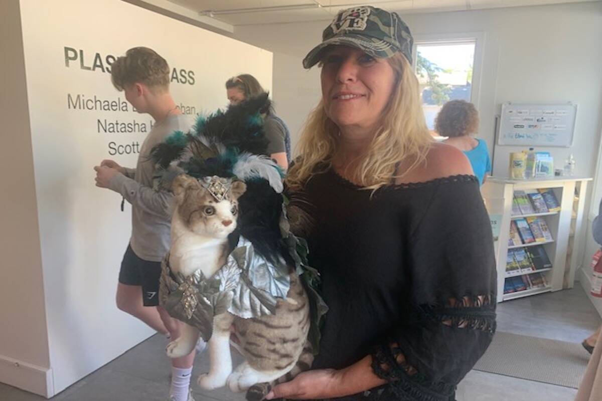 Tanya Charpontier holding her wearable art for cats submission at Lake Country Art Gallery聮s Catwalk June 26, 2022 (Brittany Webster - Black Press)