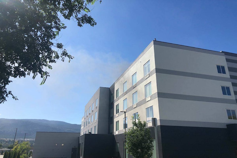 Smoke can be seen coming from the hotel. (Monique Tamminga/ Penticton Western News)