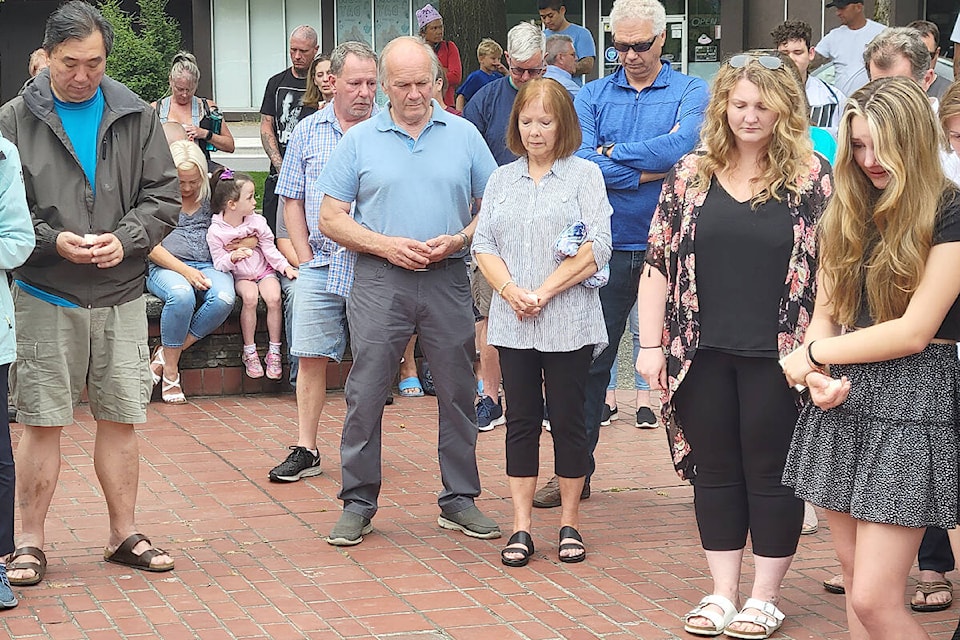 Around 200 people, many holding candles, took part in a moment of silence at a Wednesday night (Aug. 3) vigil in Langley City for victims of last week’s shooting spree. (Dan Ferguson/Langley Advance Times)