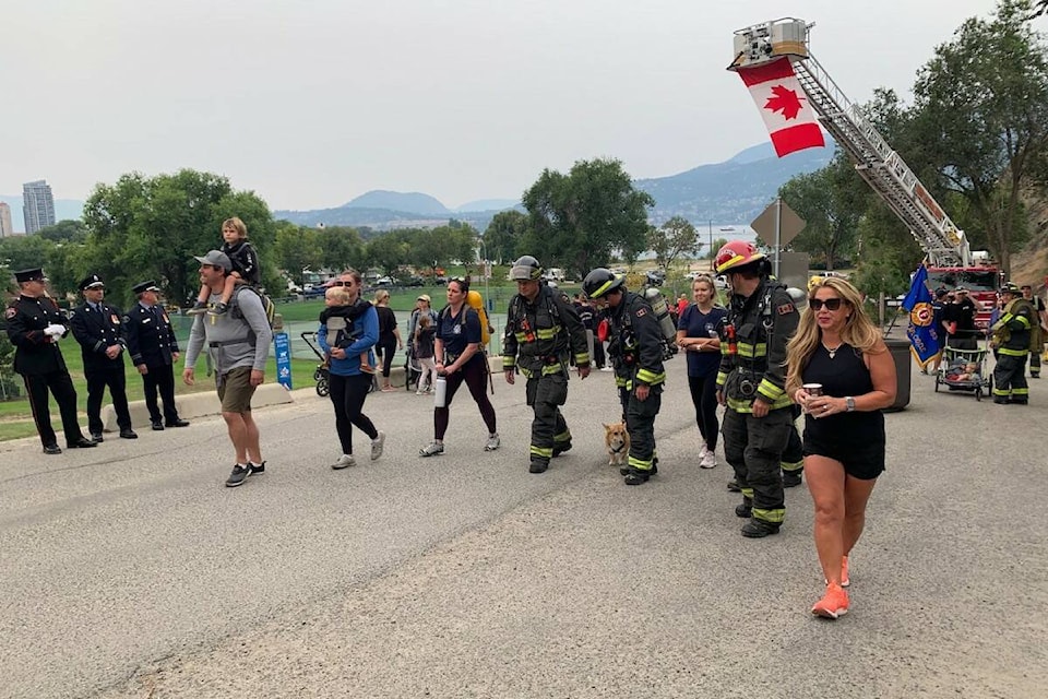 Firefighters and civilians in Kelowna marched up Knox Mountain on Sept. 11, 2022 to mark the 21st anniversary of the twin towers terror attack (Brittany Webster - Capital News)