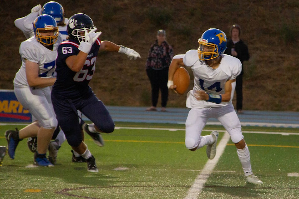 Vernon Panthers defensive lineman Mark Johnson (63) tries to chase down Rutland quarterback Ty Walker during VSS’ 27-17 pre-season Interior Senior Varsity Football Conference win over the Voodoos Friday, Sept. 9, at Greater Vernon Athletic Park. (Jenna Fochler Photo)