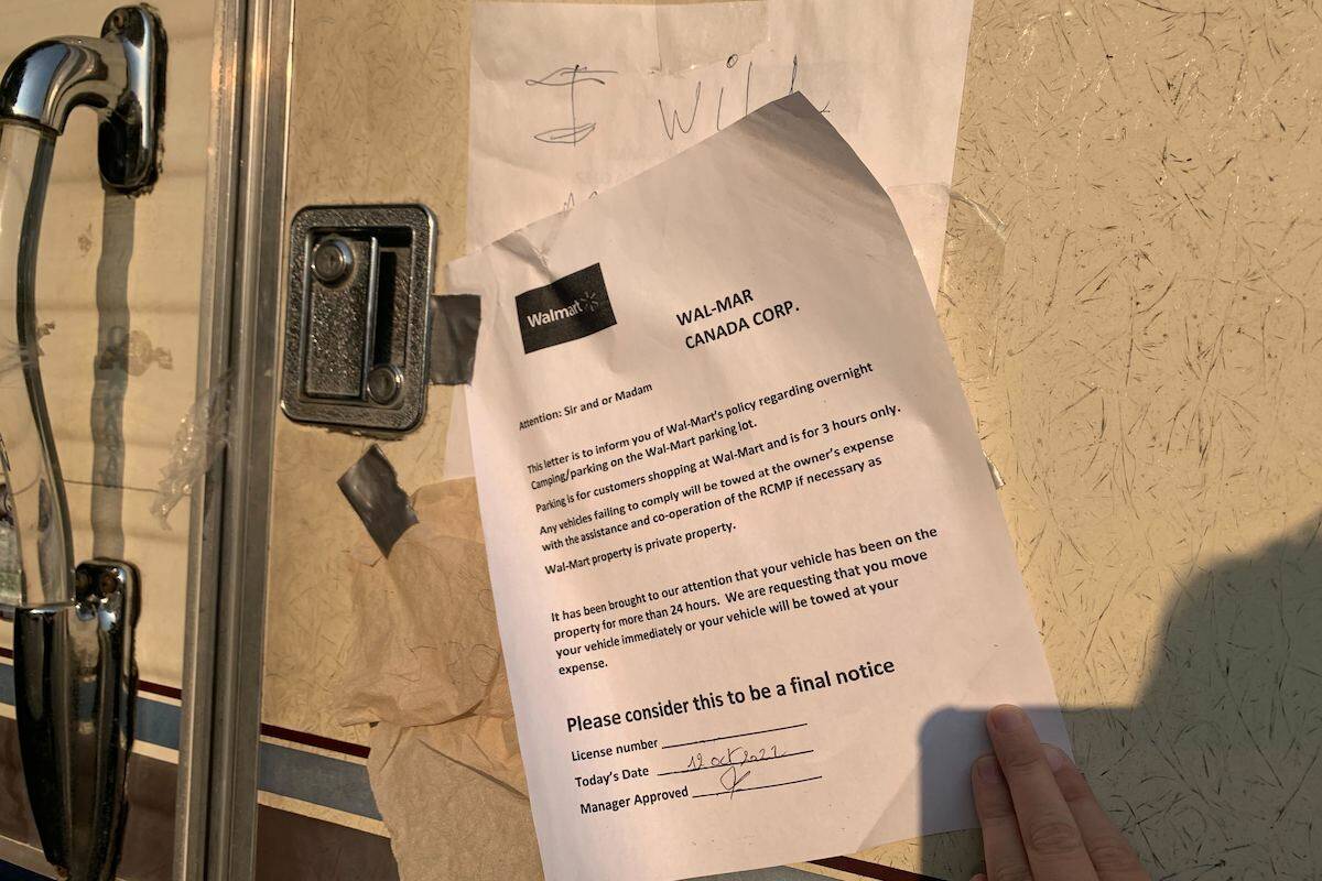 A letter from Walmart Corporate posted to the door of a camper parked in the Walmart 麻豆精选 parking lot Oct. 18, 2022 (Brittany Webster - Capital News)