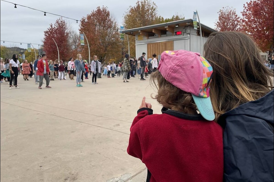 A mom and daughter watch on as Kelowna residents gather at Stuart Park dressed as zombies to dance to Michael Jackson’s ‘Thriller’ to Thrill the World (Photo - Jordy Cunningham/Capital News)