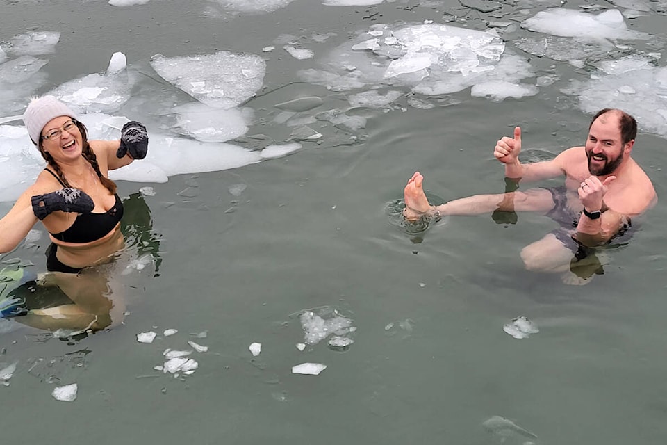 Members of the Vernon, B.C. Lake Plunge Club start off 2023 with a New Year’s Day dip in Kal Lake. (Roger Knox - Morning Star)