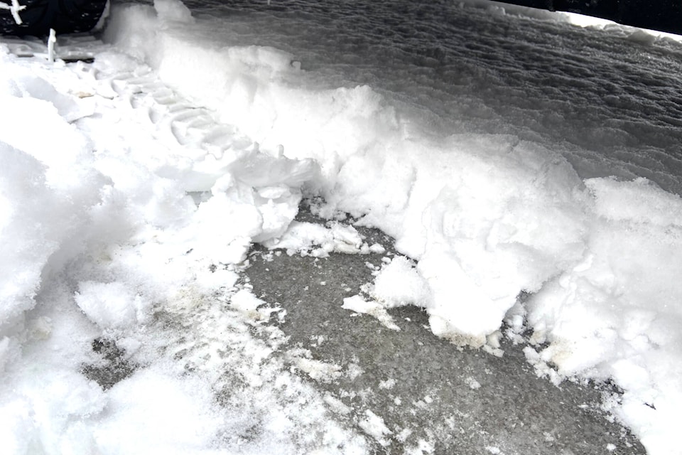 Pure ice lays under a blanket of snow on McKoryk Road in the BX Dec. 30. (Jennifer Smith - Morning Star)