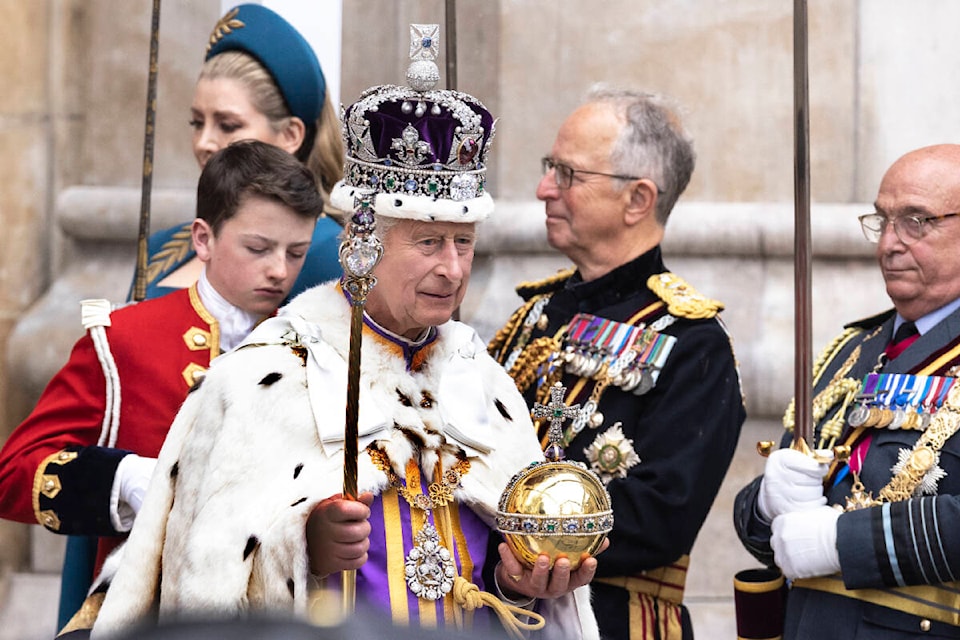Britain’s King Charles III leaves Westminster Abbey after coronation ceremony, in London, Saturday, May 6, 2023. (Humphrey Nemar/Pool Photo via AP)